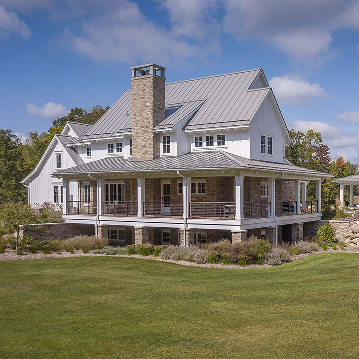 Drone footage of the front of a residential Farmhouse sheet metal roofing project Buist completed in Michigan.