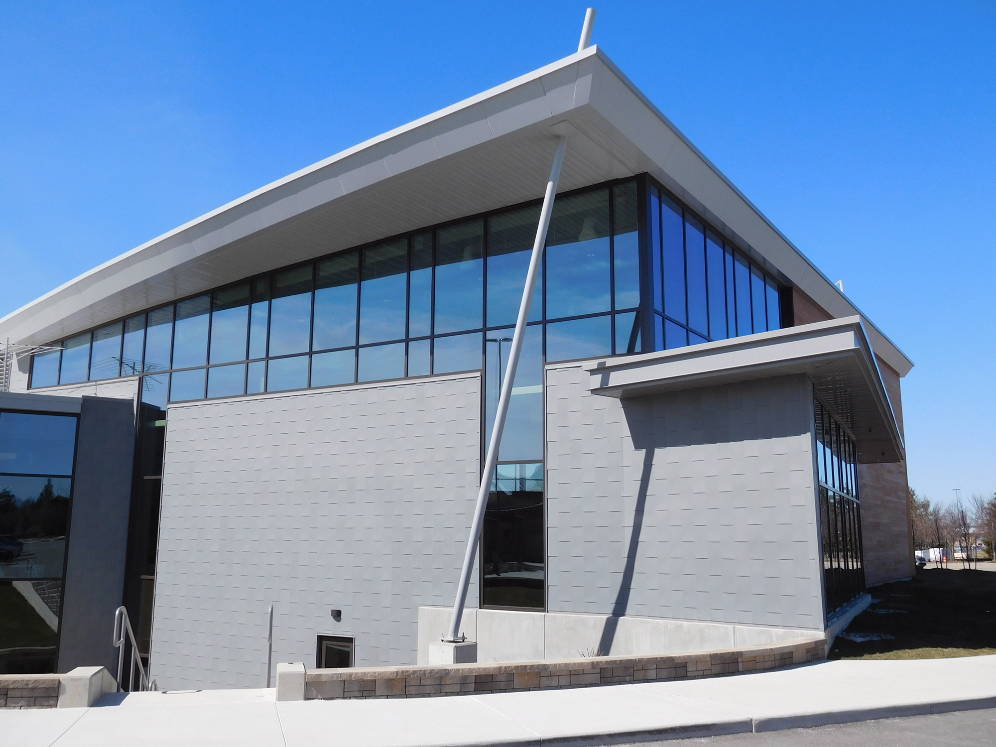 The large windows and custom metal siding on Calvary Church Grace Beyond