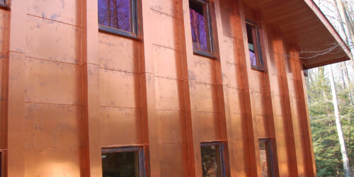 The custom copper column sheet metal that dressed the side of the Michigan lakeshore home.