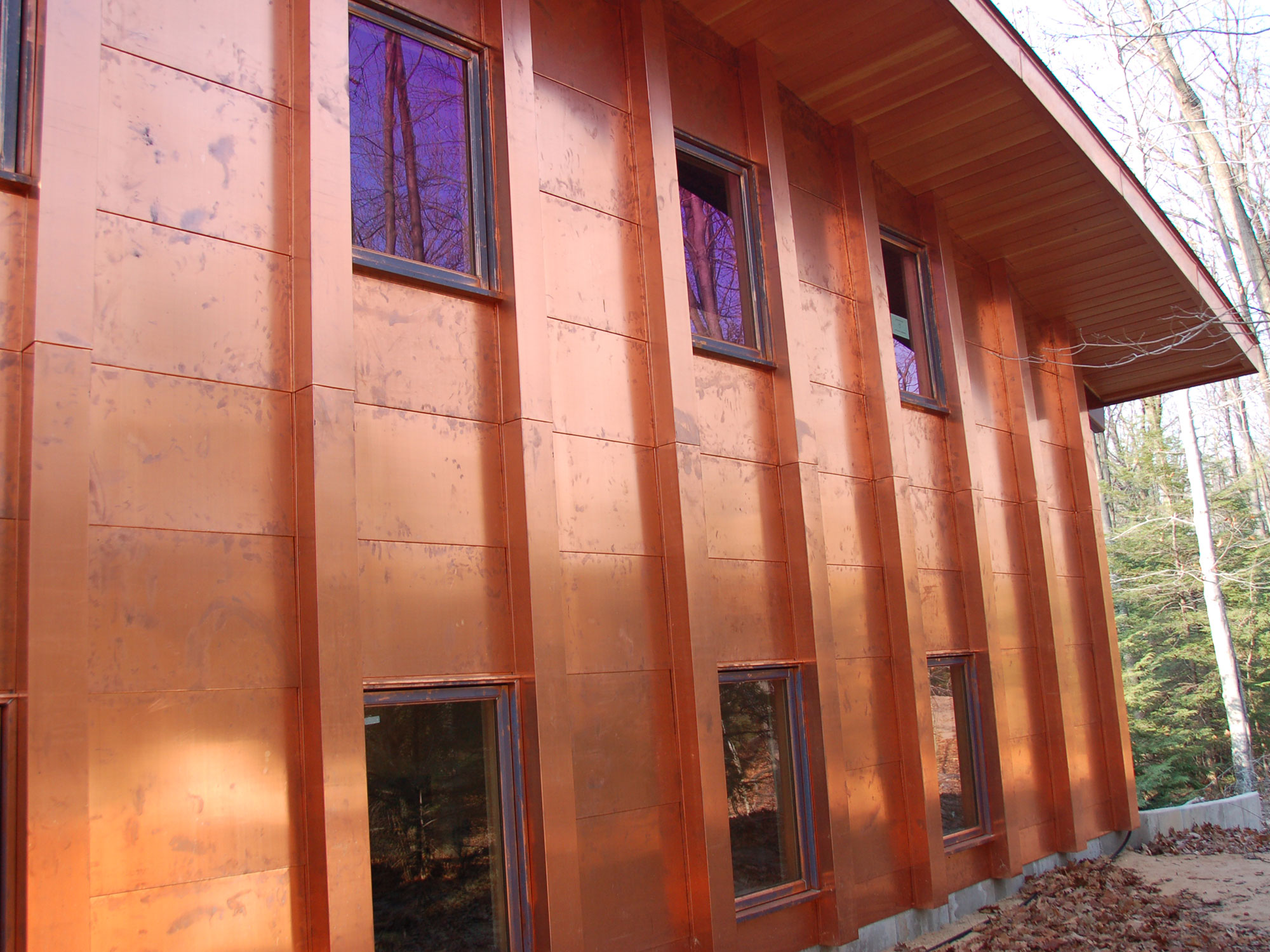 The custom copper column sheet metal that dressed the side of the Michigan lakeshore home.