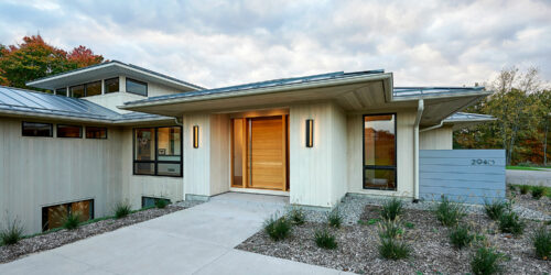 Modern Prairie Home shown during sunset, this shows the front of the home.