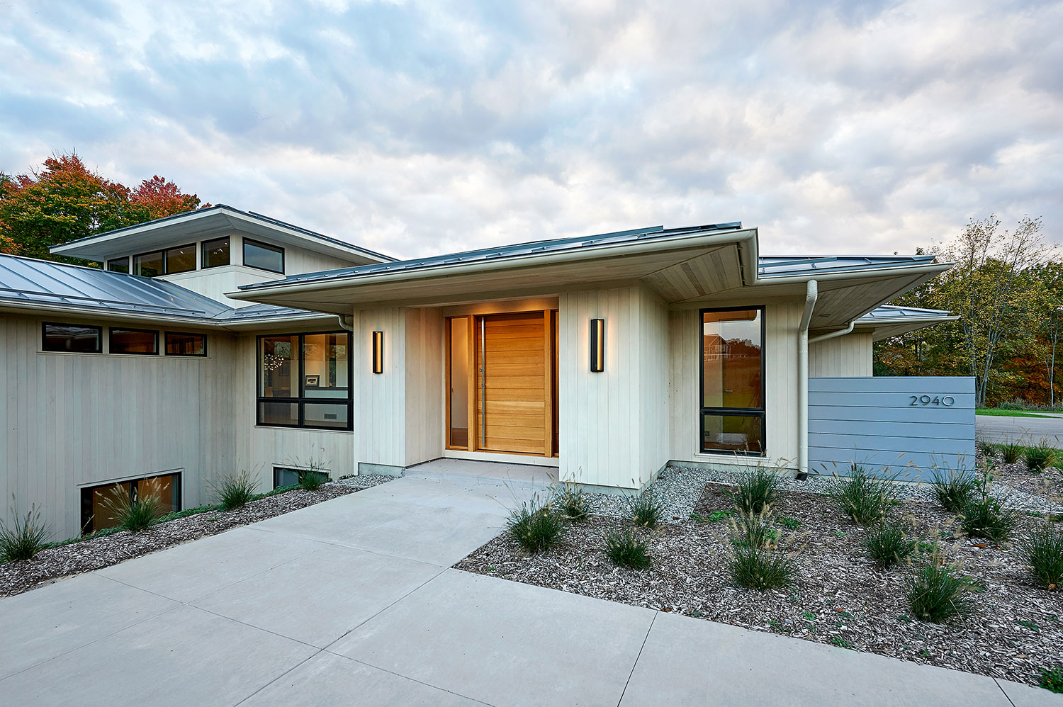 Modern Prairie Home shown during sunset, this shows the front of the home.