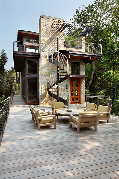 Side view of the Dunes residential sheet metal construction project shows a beautiful spiral staircase descending from the third floor down to the main deck.