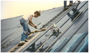 Brian Ritsema works on a metal roofing project for the Prince Tech Center - circa 1980s